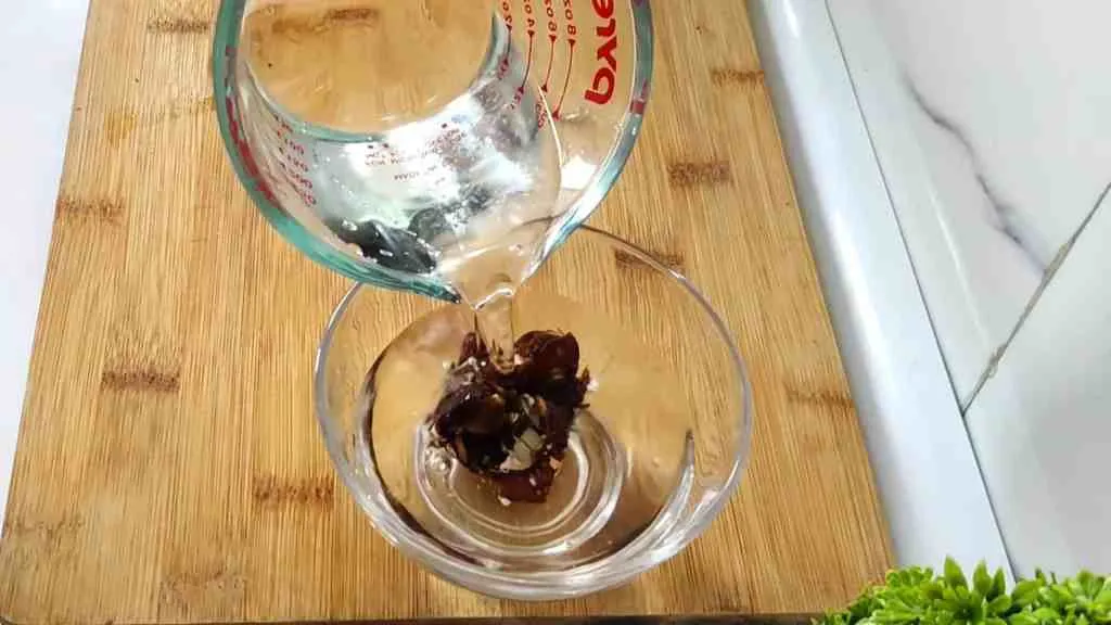 Soak tamarind in hot water