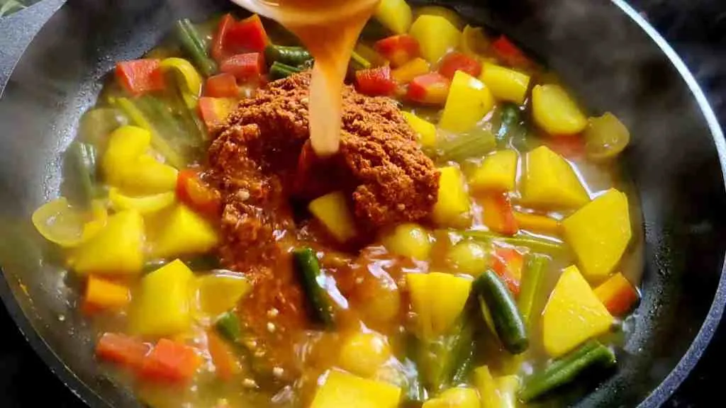 Add tamarind and sambar masala paste